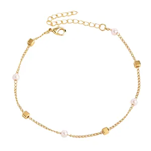 Detailed view of elegant gold stainless steel anklet with delicate pearls and square beads