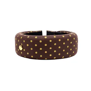 Stylish brown polka dot wide fabric headband with gold button detail for women, casual accessory
