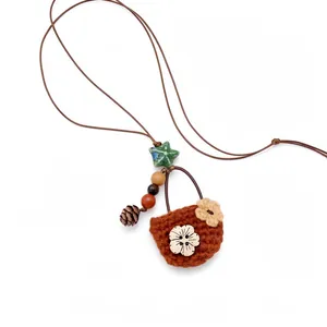 Vintage pastoral flower basket pendant necklace with leather cord and pinecone charm