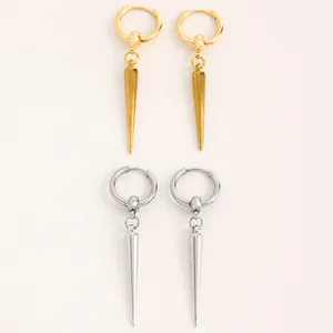 Detailed view of gold and silver gothic spike rivet hoop earrings on white background