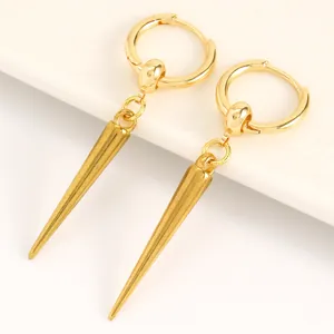 Close-up of gold-colored gothic punk rivet spike hoop earrings with smooth texture