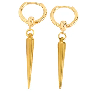 Detailed macro shot of golden gothic punk spike drop earrings featuring sleek metallic huggie hoops