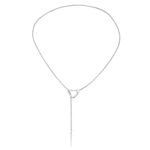Detailed view of elegant silver lariat necklace with heart charm and punk spike pendant