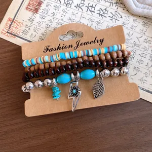 Bohemian multi-layer bracelet set with wood beads, turquoise stones, and leaf charms.