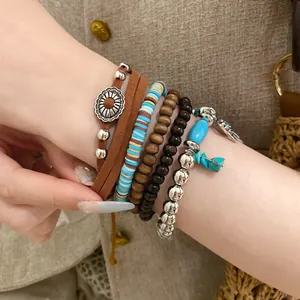 Close-up of bohemian multilayer beaded bracelet set with leather and turquoise accents