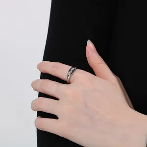 Macro view of stainless steel ring featuring engraved 11:11 angel number design