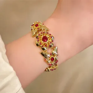 Vintage gold flower bracelet with pink rhinestones for a luxury aesthetic style