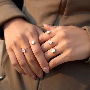 Detail view of adjustable gold stainless steel chain rings with sparkling zircons