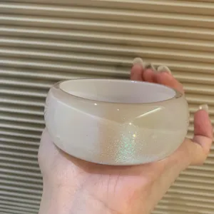 Vintage wide acrylic oval bangle bracelet with shimmering iridescent glitter finish