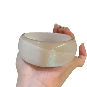 Elegant vintage iridescent acrylic oval bangle featuring a chunky geometric design