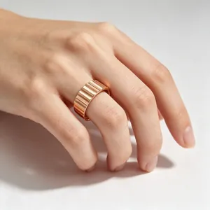 High-quality detail of a 9mm wide rose gold ribbed titanium steel industrial ring.