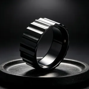 Close-up of 9mm wide black titanium steel ring with industrial gear texture