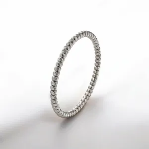 Elegant twisted rope bangle made of polished stainless steel for a minimalist look.