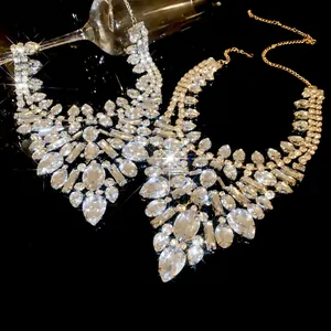 Luxury Western-style banquet necklace with sparkling teardrop and square crystals on black surface