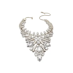 Elegant statement silver-tone bib necklace featuring teardrop and oval clear crystals