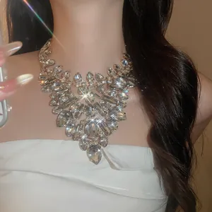 Detailed shot of luxury rhinestone bib necklace with teardrop and square crystals