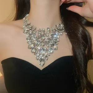 Detailed shot of a luxury clear crystal heavy statement necklace on a fashion model