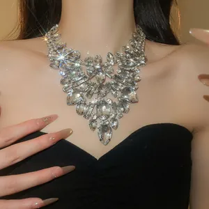 Detailed close-up of a glamorous banquet necklace with sparkling crystals and teardrop stones