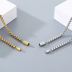 Detail view of gold and silver stainless steel necklaces with magnetic ball clasps