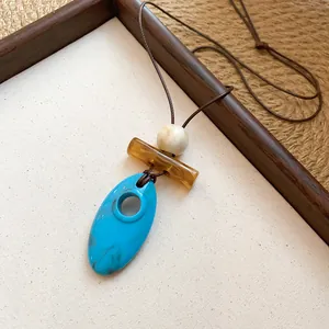 Ethnic style resin pendant necklace with turquoise and amber geometric elements