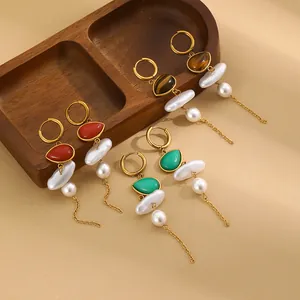 Close-up showing various colors of 18K gold plated tassel earrings with pearls.