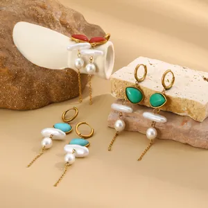 Macro view of gold-plated stainless steel earrings with colorful acrylic stones and pearls