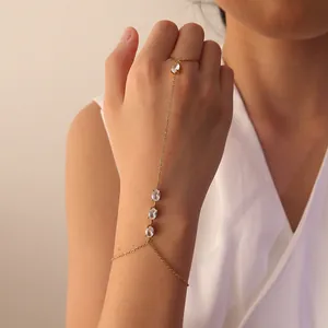 Elegante pulsera de dedo en acero inoxidable dorado con circonitas ovaladas claras