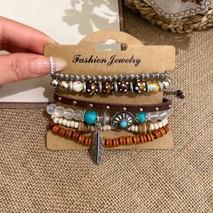 Vintage bohemian multi-layer bracelet set featuring wooden beads and silver feather charm