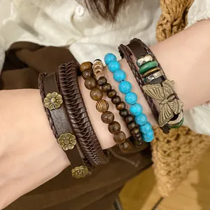 Detailed view of bohemian bracelet set with turquoise beads and butterfly charm