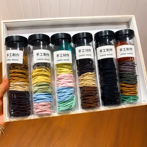 Set van 6 kokers kleurrijke elastische haarelastiekjes in levendige dopamine-regenboog
