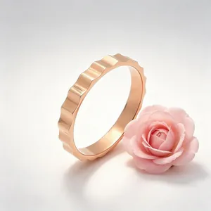 Detail shot of a rose gold gear-shaped stainless steel industrial ring with a rose