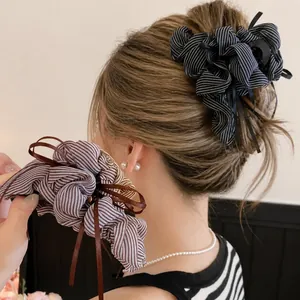 Elegant striped bow hair claw clip with pleated fabric tassels for women's hair accessories
