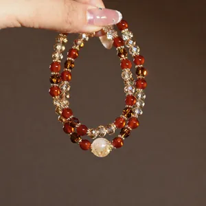 Close-up of double-layer beaded crystal bracelet with a large clear citrine bead
