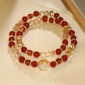 Close-up of double-layer beaded crystal bracelet with red and champagne beads
