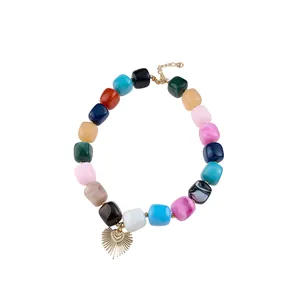 Vibrant colorful resin cube bead necklace with a golden heart sunburst charm pendant.