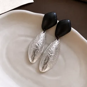 Elegant vintage geometric wood and textured silver oval pendant drop earrings for women