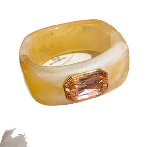 Luxury geometric resin bangle with peach crystal stone, stylish marble pattern bracelet