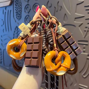Creative food simulation keychain with braided rope, pretzel and chocolate bar charms