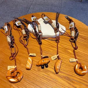 Set of realistic simulated bread charms and keychains with brown braided straps and tags