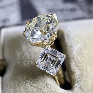 Elegant gold alloy Toi et Moi ring with round and square zircon stones, high-end look.