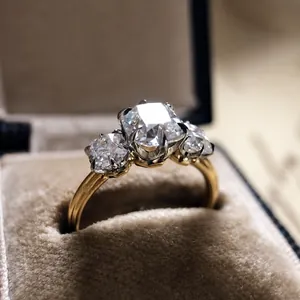 Close-up of vintage three-stone engagement ring with sparkling cubic zirconia