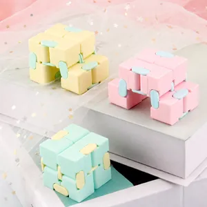 Macaron infinity cube fidget toy for stress relief in pink yellow and mint colors