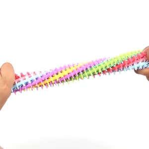 Colorful stretchy TPR unicorn sensory noodle toy pulled to demonstrate its high elasticity.