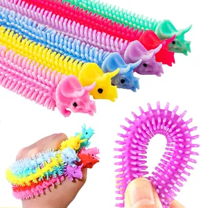 Close-up of colorful dinosaur stretchy fidget bracelets made of textured TPR rubber