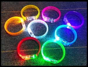 Detail view showing seven vibrant colors of glowing acrylic LED bracelets for events