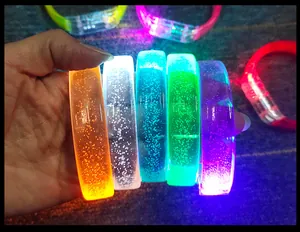 Detail view of colorful glowing LED acrylic bubble bracelets for parties and concerts
