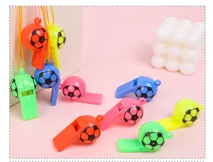 Detailed close-up showing a variety of colorful soccer-shaped plastic whistles with lanyards.