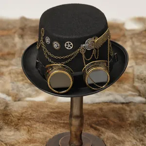 Macro view of black steampunk top hat featuring metallic gears, wings, and goggles