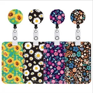 Detail view of four vibrant floral retractable badge reels with matching ID holders.