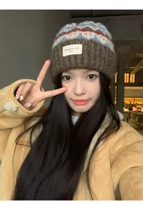 Stylish vintage pattern knit beanie on model for warm and cozy winter winter fashion